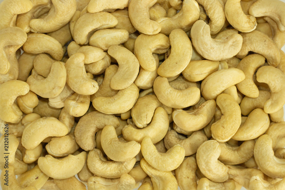cashew nuts , yellow color beans background cashew nuts , yellow color beans background