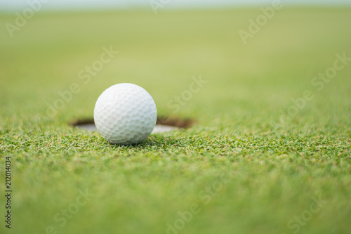 Blerred Close up of golf ball on green