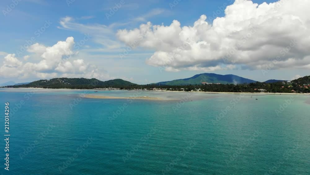 Aerial view of tropical sea and beach on white cloud and blue sky Aerial view of tropical sea and beach on white cloud and blue sky