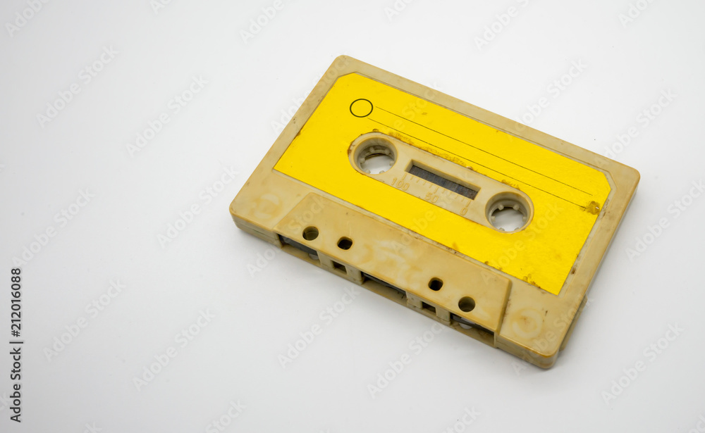 Obraz premium close up of old and dirty vintage audio tape cassette isolated on white
