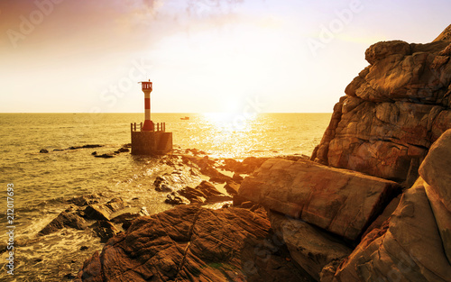 lighthouse by the sea photo