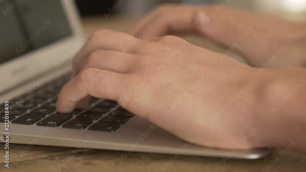 Typing on a keyboard from a laptop. Typing on a keyboard from a laptop.