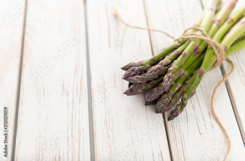 Fresh Asparagus Spears on Distressed White Washed Wood