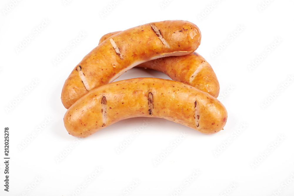 Grilled sausages isolated on a white background Grilled sausages isolated on a white background