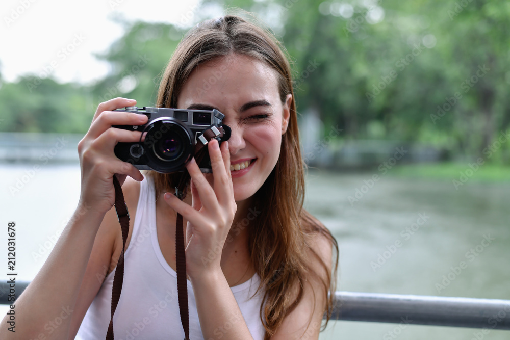 Travel concept. beautiful girls are traveling in the woods. Beautiful women are taking photos in the forest. Travel concept. beautiful girls are traveling in the woods. Beautiful women are taking photos in the forest.