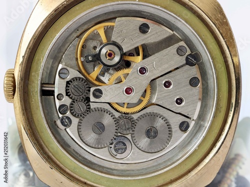 Defective dirty gear and gears from old mechanical wristwatches photo