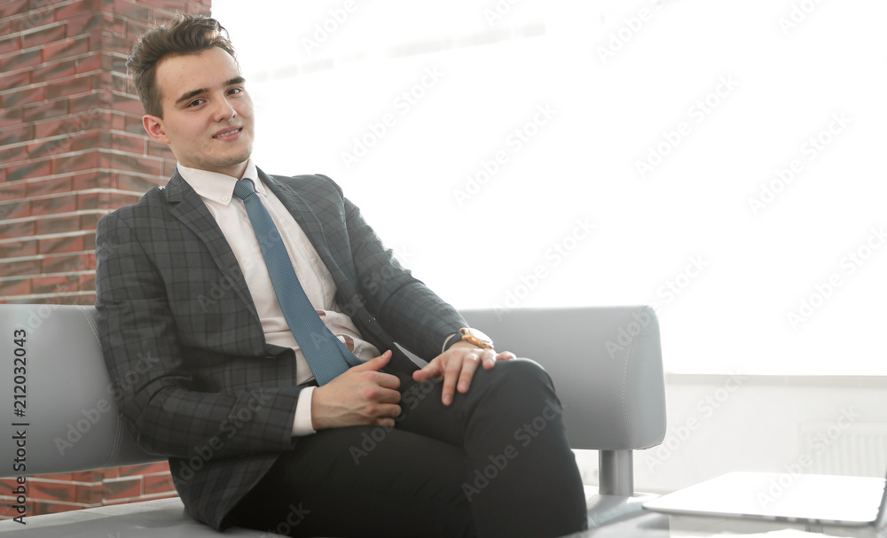successful businessman sitting on office sofa successful businessman sitting on office sofa