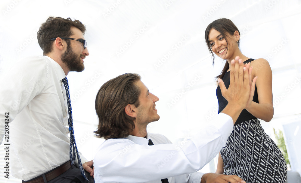 handsome man and beautiful woman giving hi five handsome man and beautiful woman giving hi five