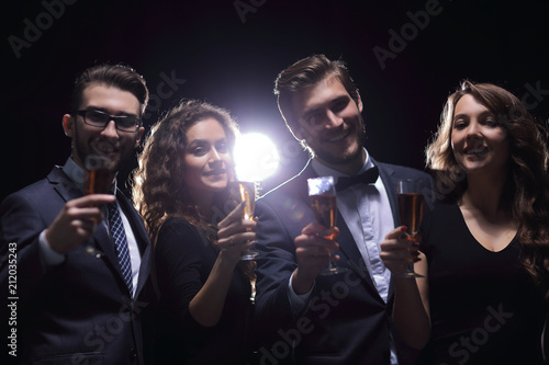 portrait of a group of friends celebrating their success