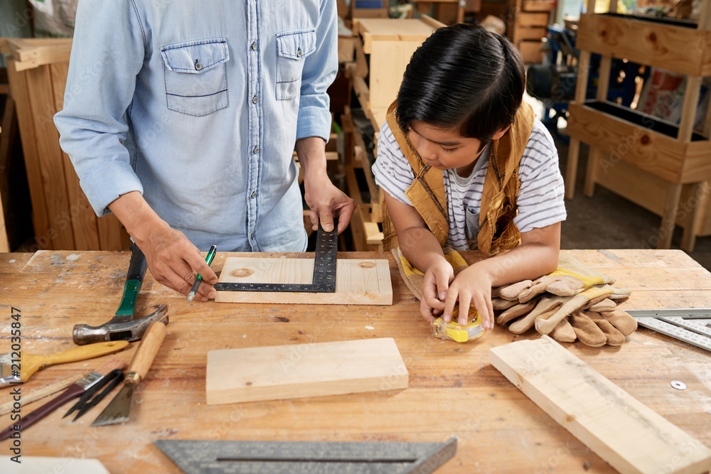 Carpenter teaching son Carpenter teaching son