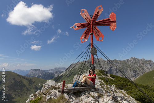 woman on the summit of leobner mauer, peak in the mountain range hochschwab, styria,austria photo