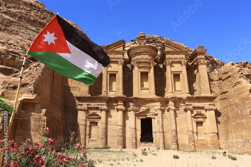 Ad Deir, The Monastery Temple of Petra with the flag of Jordan in the foreground, Jordan