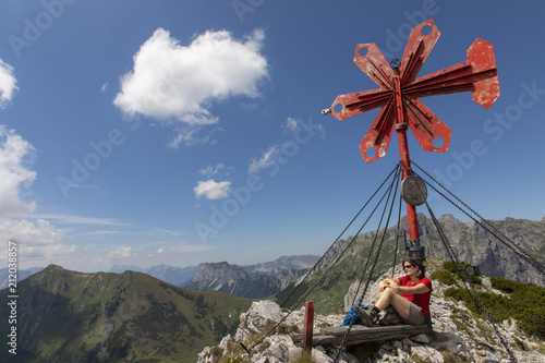 woman on the summit of leobner mauer, peak in the mountain range hochschwab, styria,austria photo