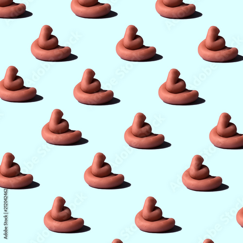 pink poo  on colorful background, funny poop concept, pop minimal contemporary style photo