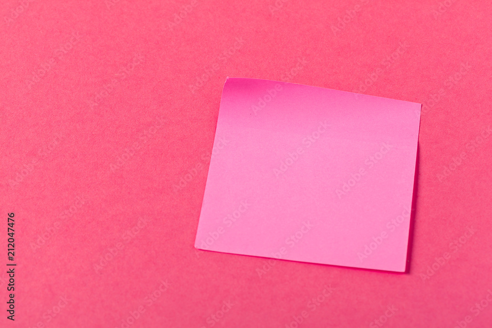 Blank paper pieces on a colored pink background Blank paper pieces on a colored pink background
