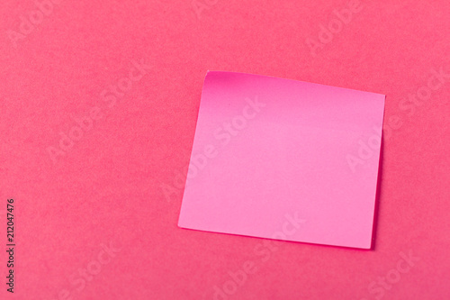 Blank paper pieces on a colored pink background