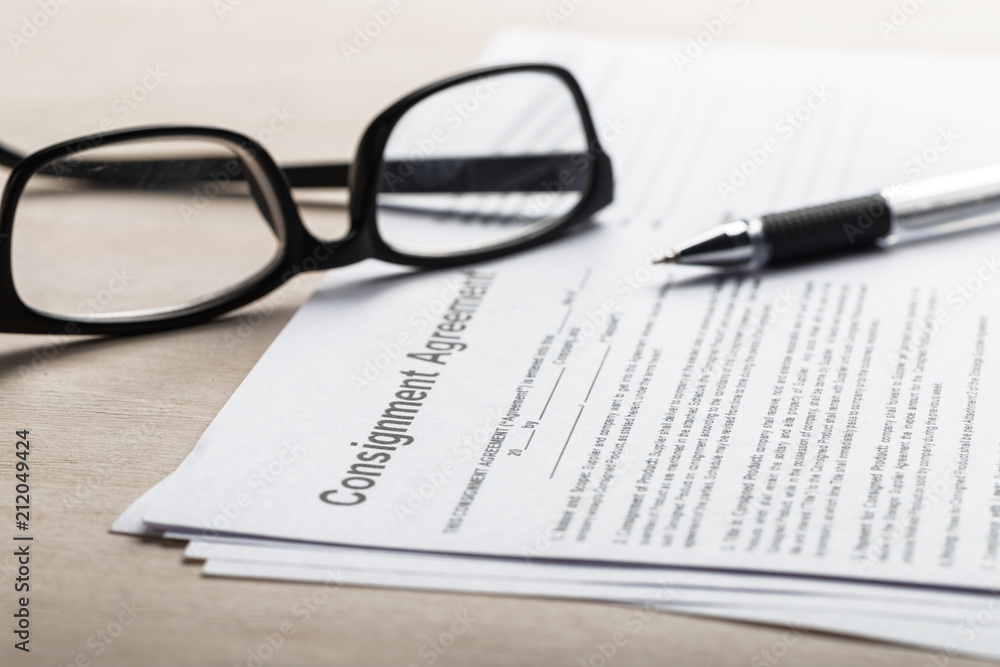 Close up shot of Eyeglasses on contract document papers business concept Close up shot of Eyeglasses on contract document papers business concept