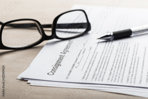 Close up shot of Eyeglasses on contract document papers business concept