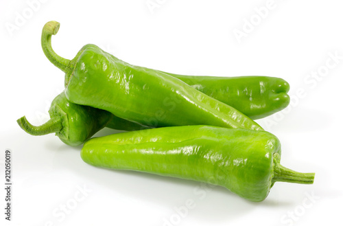 Green vegetables. Organic fresh long green peppers or green chilli horizontal isolated on white background, with clipping path.