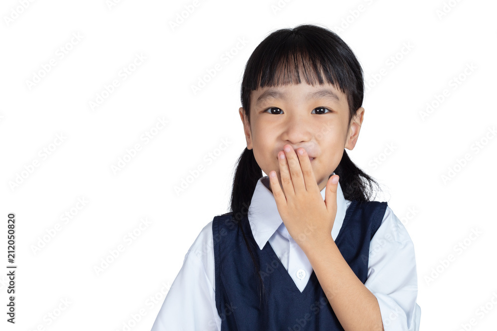 Asian Chinese little girl in uniform laughing and covering her mouth Asian Chinese little girl in uniform laughing and covering her mouth