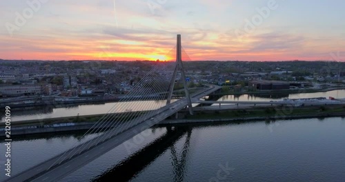 Aerial view of steel cable bridge crossing in Belgium. Road in perspective. European bridge over a river at sunset. photo