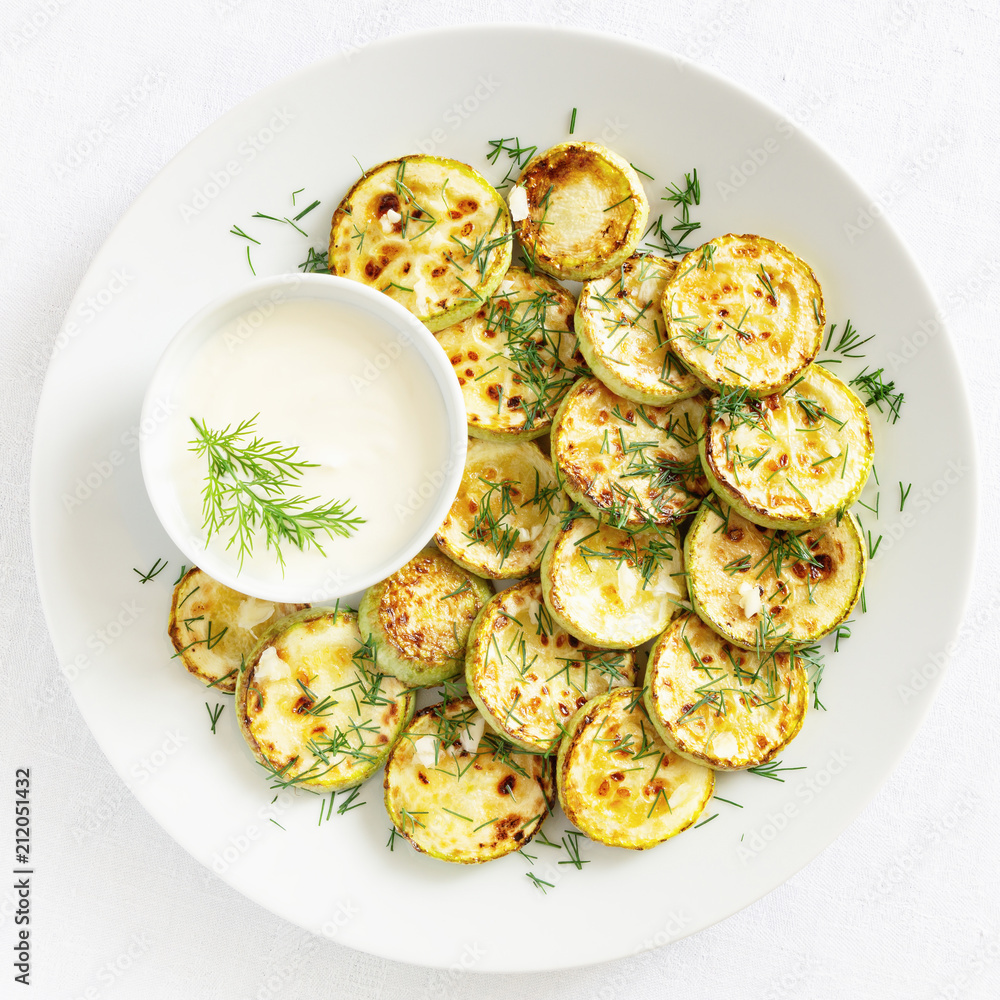 fried courgettes with yougurt dip sprinkled with dill and garlic fried courgettes with yougurt dip sprinkled with dill and garlic