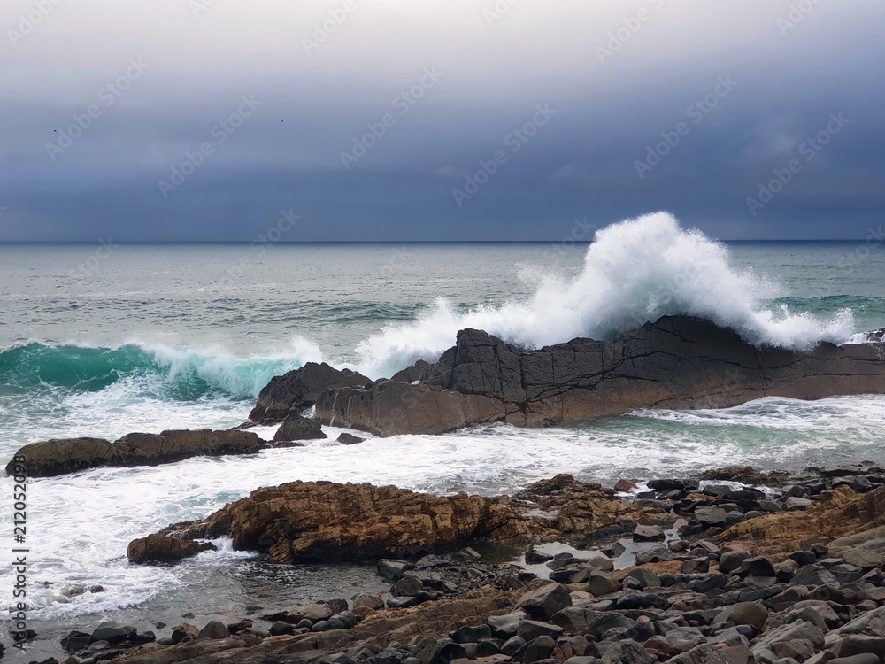 Australian Coastline big surf hitting rocky shore