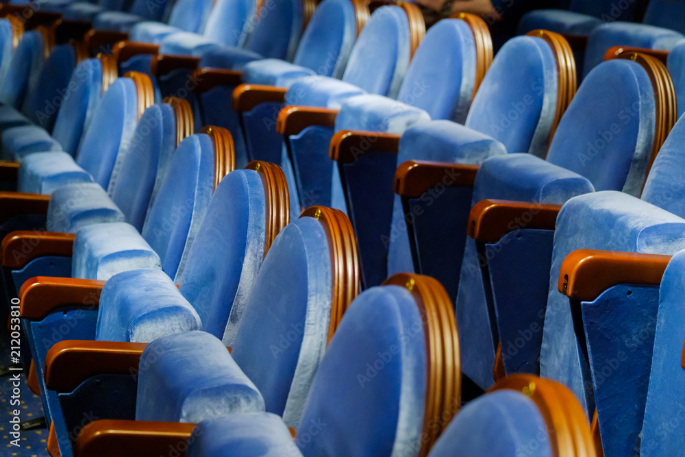 Naklejka premium Chairs in the row at the big hall