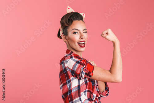 Fotobehang Gorgeous strong young pin-up woman showing biceps.