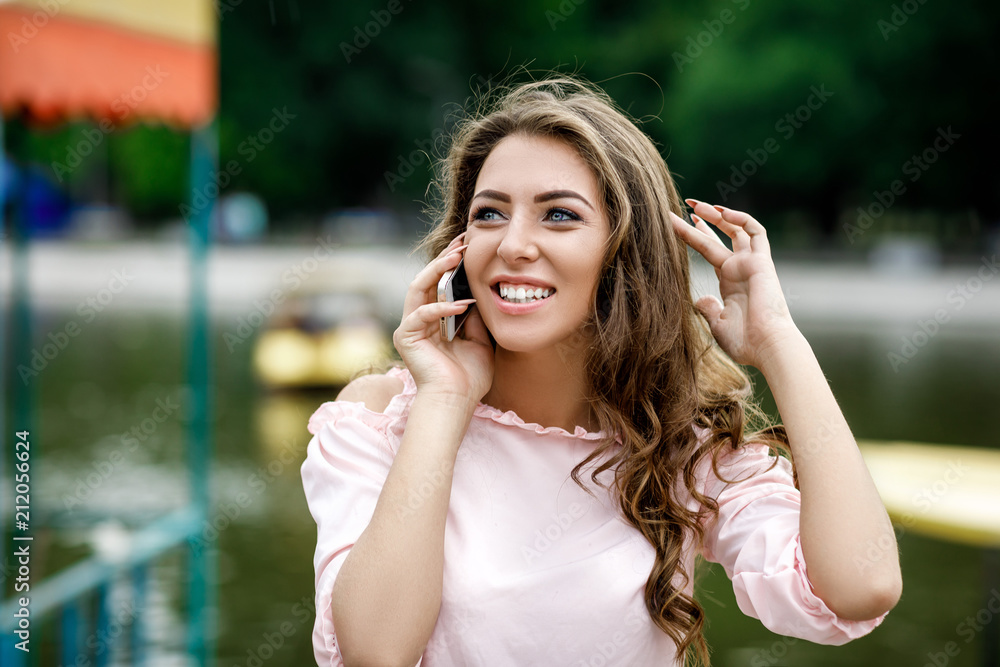Fototapeta premium young woman talking on the phone