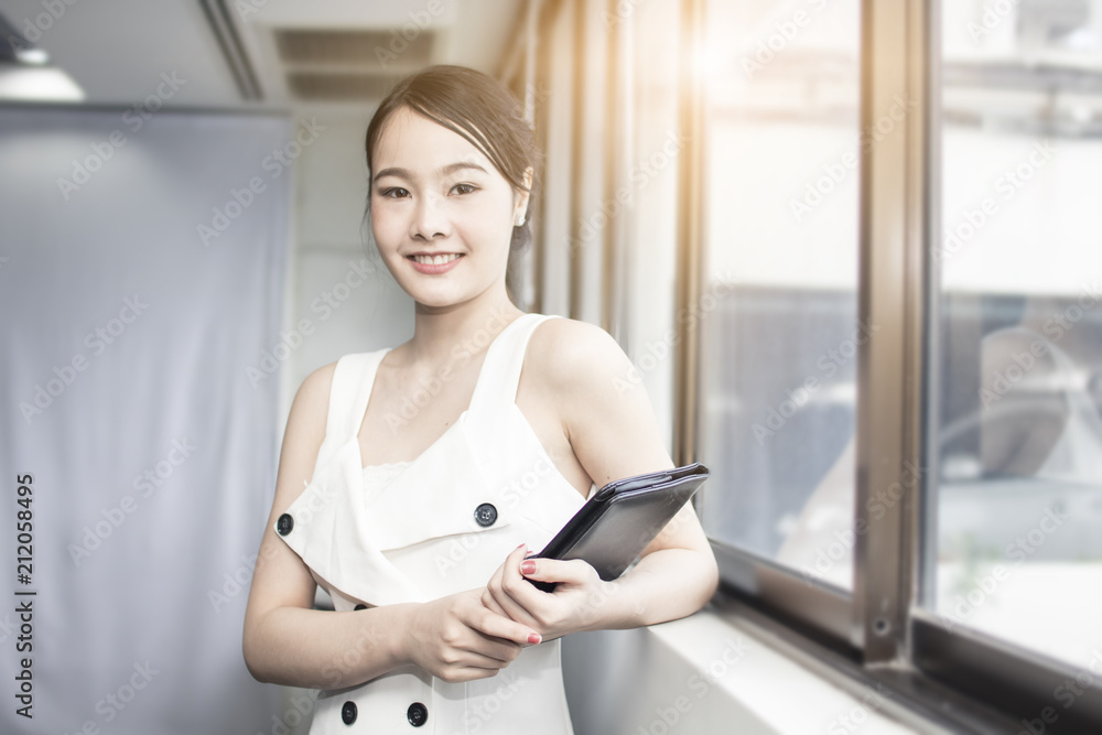 portrait of confident business woman standing in office portrait of confident business woman standing in office