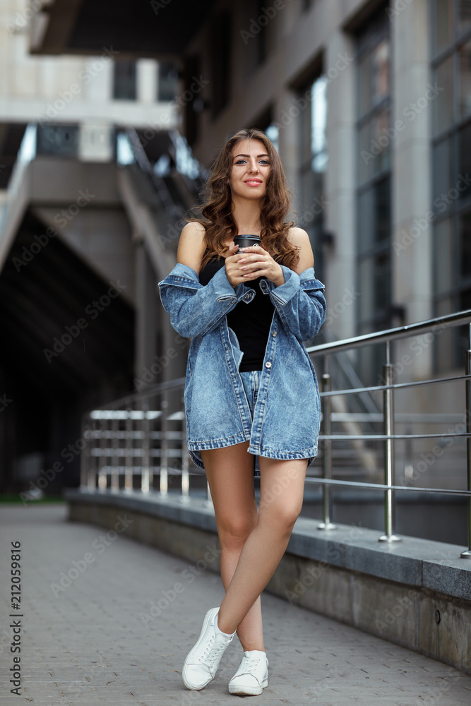 woman with coffee on the street woman with coffee on the street