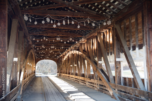 American Covered Wood Bridge on a Sunny Winter Day. photo