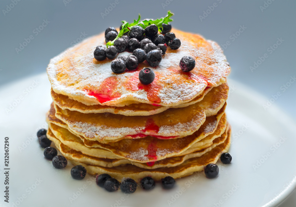 Pancakes with berries and sugar