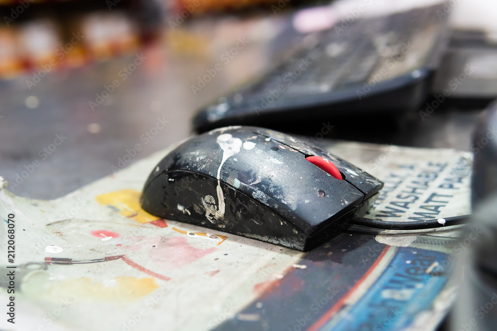Dirty computer mouse with paint on it. Stock Photo | Adobe Stock
