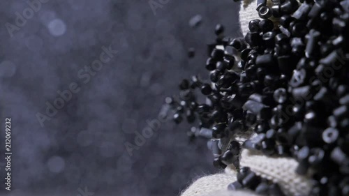 Plastic black gray granulated crumb. Manufacture of plastic water pipes of the factory. Process of making plastic tubes on the machine tool with the use of water and air pressure.