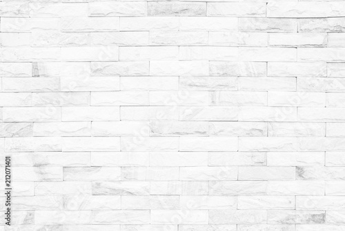 White brick wall texture background or stonework flooring interior rock old pattern clean concrete grid uneven bricks design stack. grey colors brick wall art concrete stone texture in wallpaper 