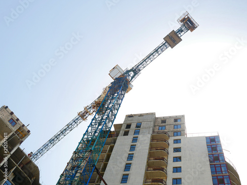 Crane. Construction crane. Construction crane on the background of the building. photo