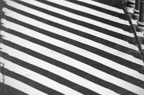 Abstract Shadows of Lines and Figures on a Road as Background or Texture, Black and White Picture