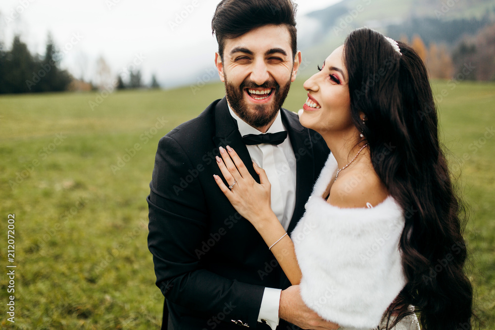 Wonderful bride and groom on the green field Wonderful bride and groom on the green field