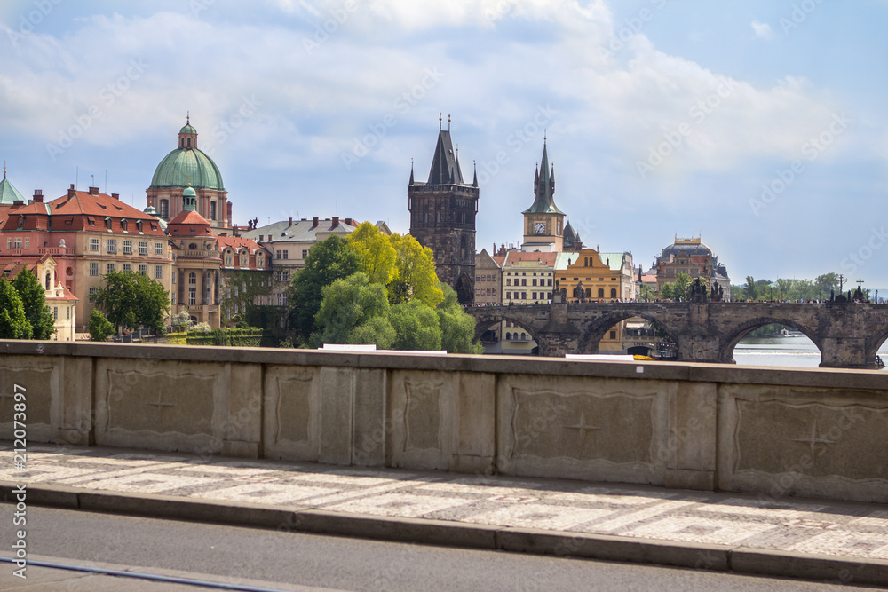 Fototapeta premium View to the Charles Bridge and St. Nikolaus Church in Prague