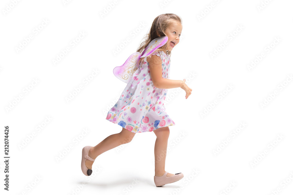 Smiling cute toddler girl three years running over white background Smiling cute toddler girl three years running over white background