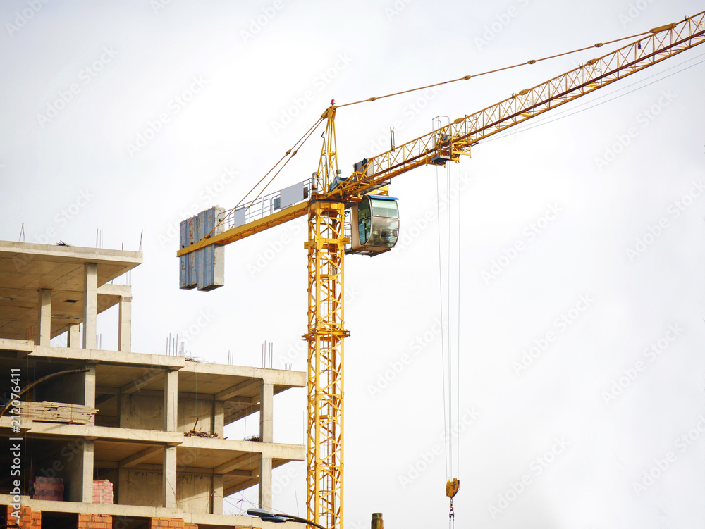 Construction crane near building. Construction site