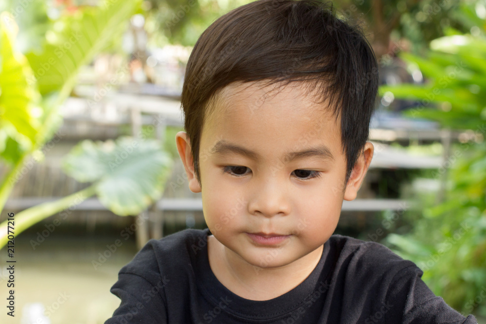 Close up happy little asian boy on nature background. Close up happy little asian boy on nature background.