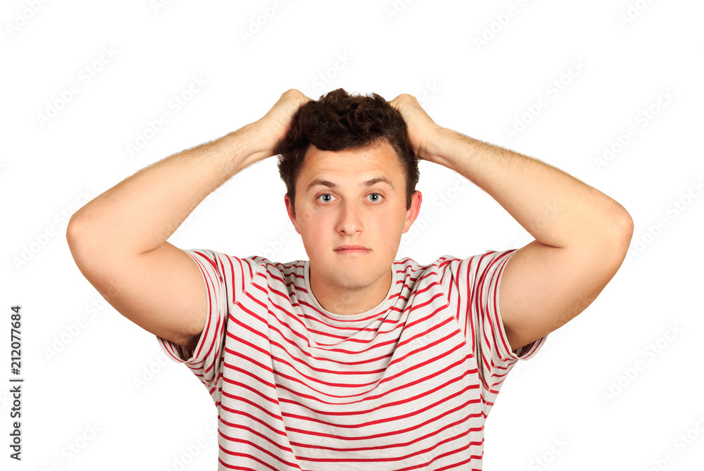 Despair man keeps his hands on his head. emotional guy isolated on white background Despair man keeps his hands on his head. emotional guy isolated on white background