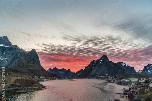 The fishing harbour of Reine at Lofoten Islands / Norway at midnight after sunset