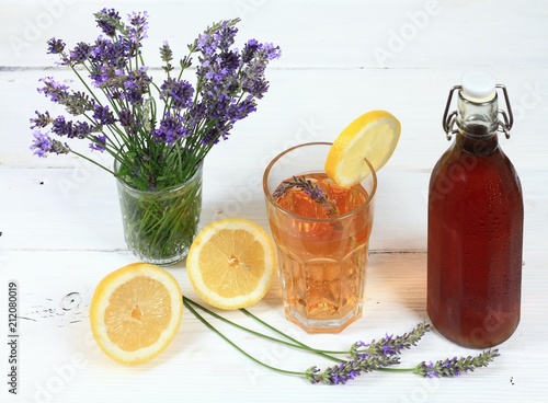 Homemade lavender syrup in  bottle & lemonade / Made from fresh aromatic lavender flowers, sugar or honey and lemon juice