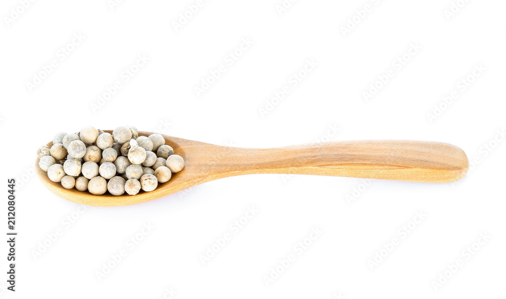 Pepper seed in wood spoon on white background Pepper seed in wood spoon on white background