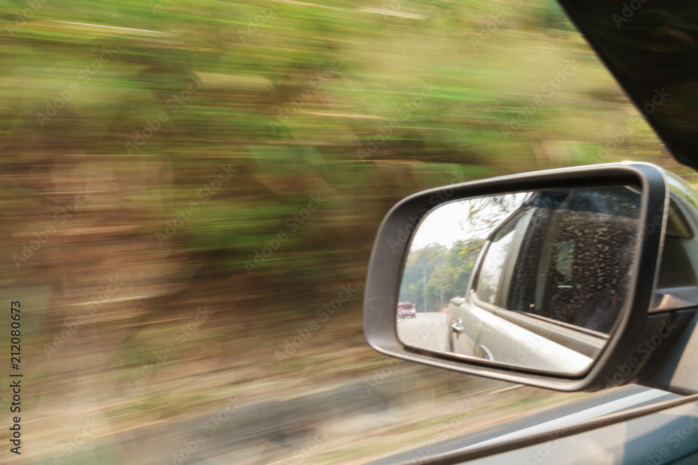 Car and rear view mirror, look in the rear view mirror of a car.
