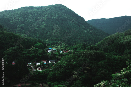 Green mountains and village